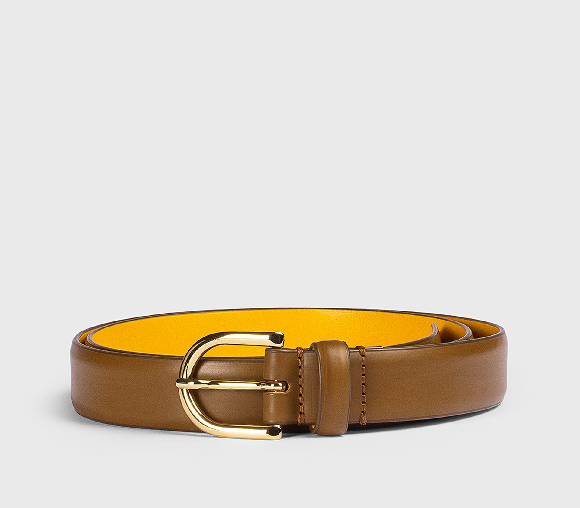 Tan leather belt with “D” buckle