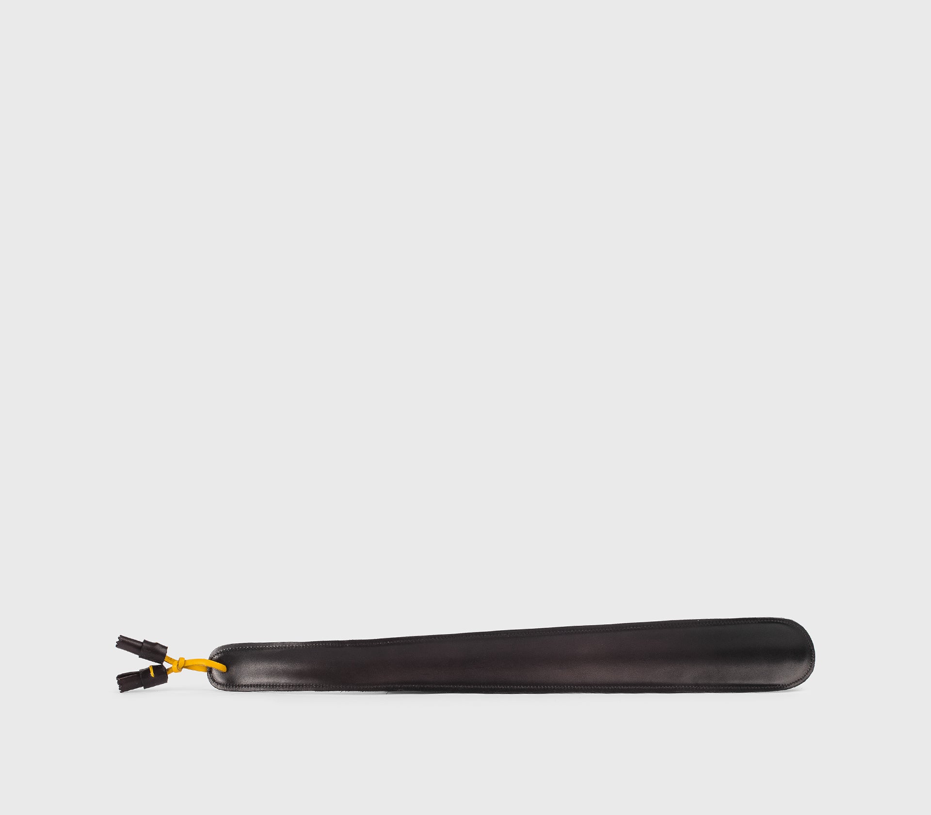 Large shoehorn in dark brown leather