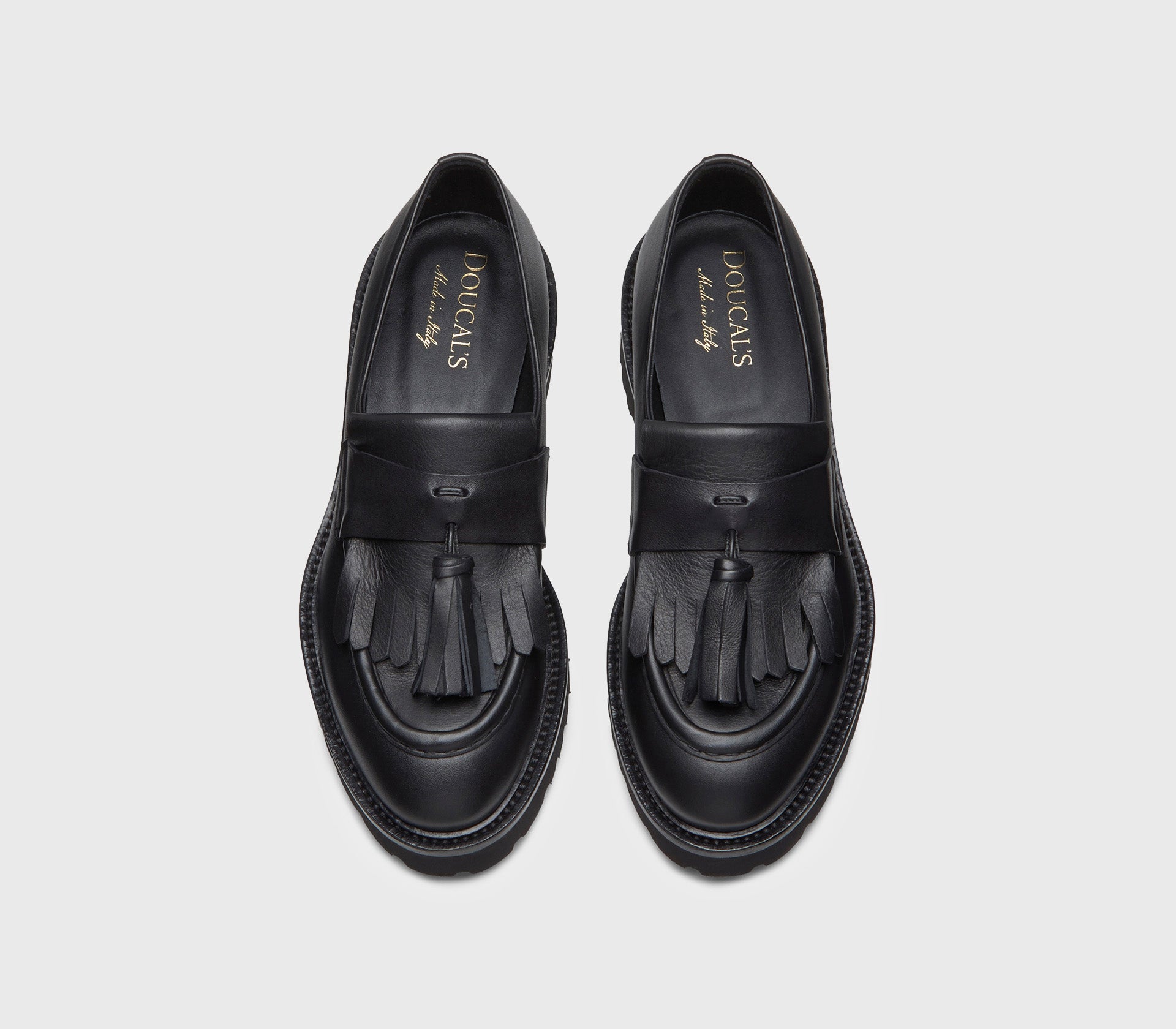 Black leather loafer with fringe and tassels