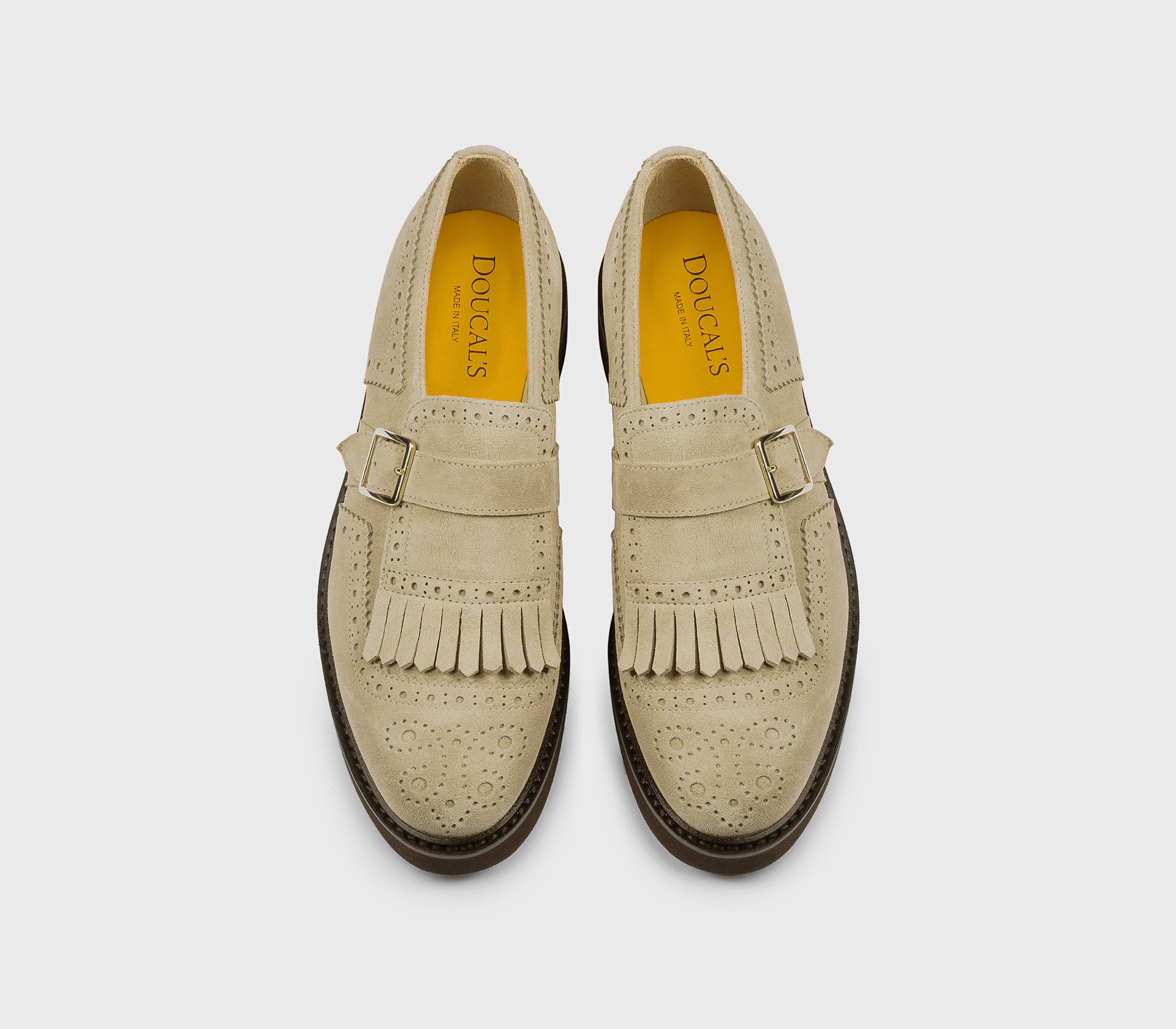 Sand-coloured suede single-buckle shoe with fringing.