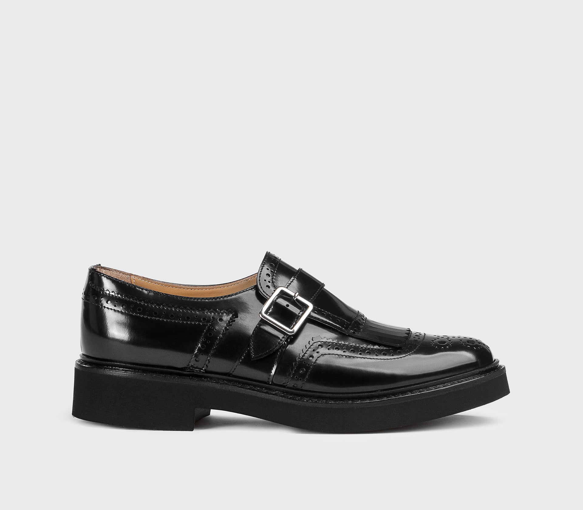 Black leather single-buckle shoe with fringing