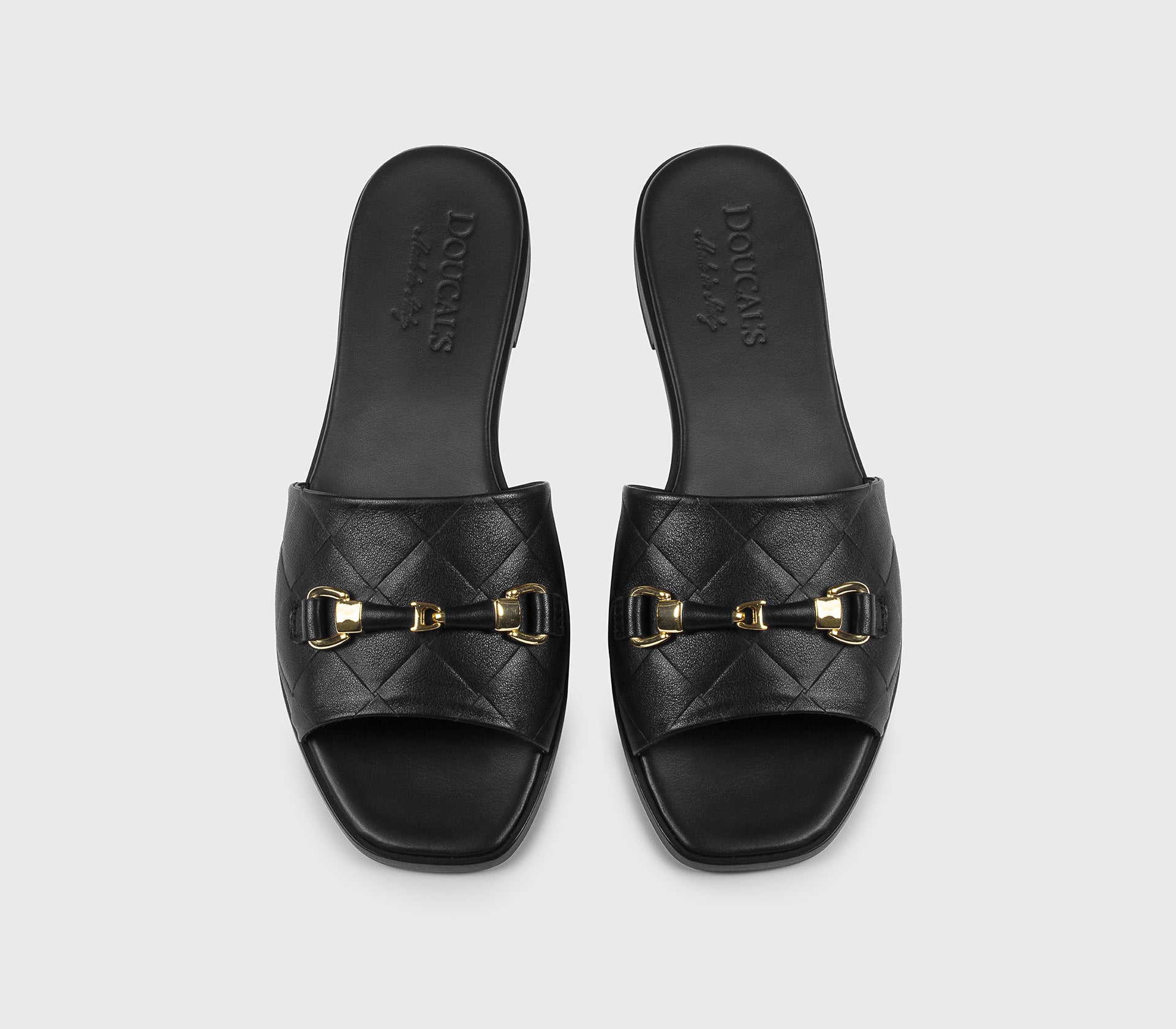 Black leather sandal with metal accessory