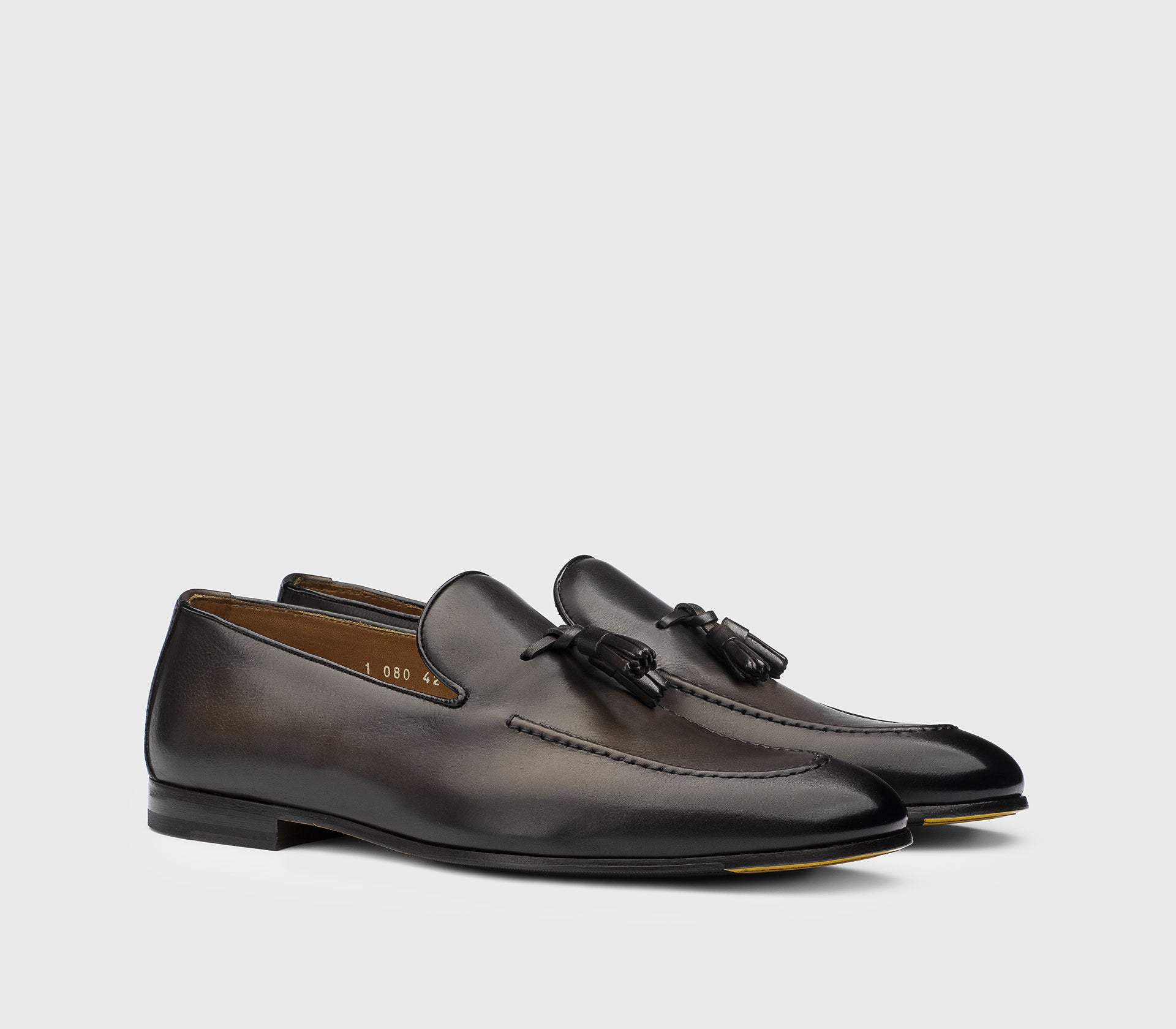 Dark brown leather loafer with tassels