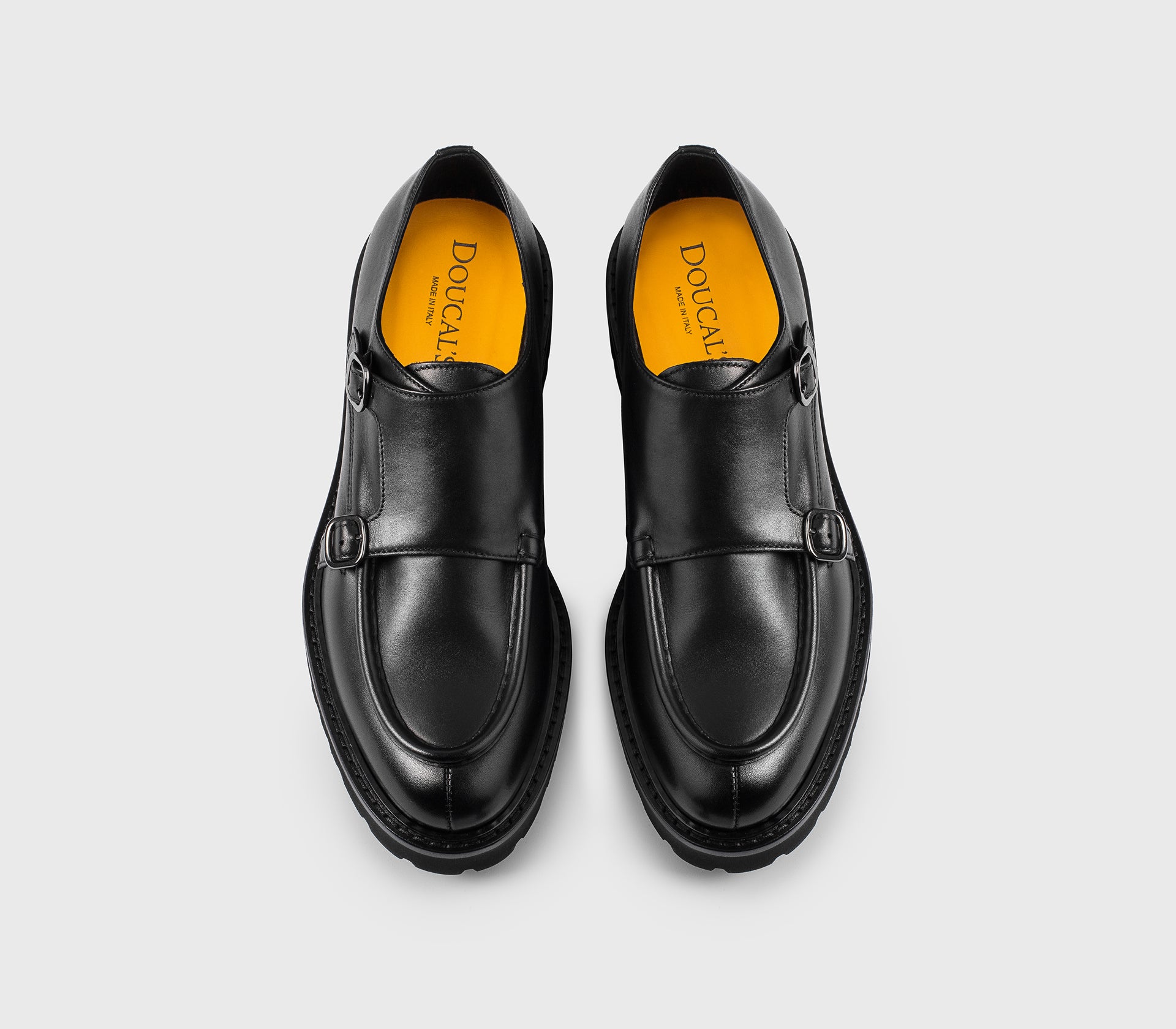 Black leather double-buckle shoe.