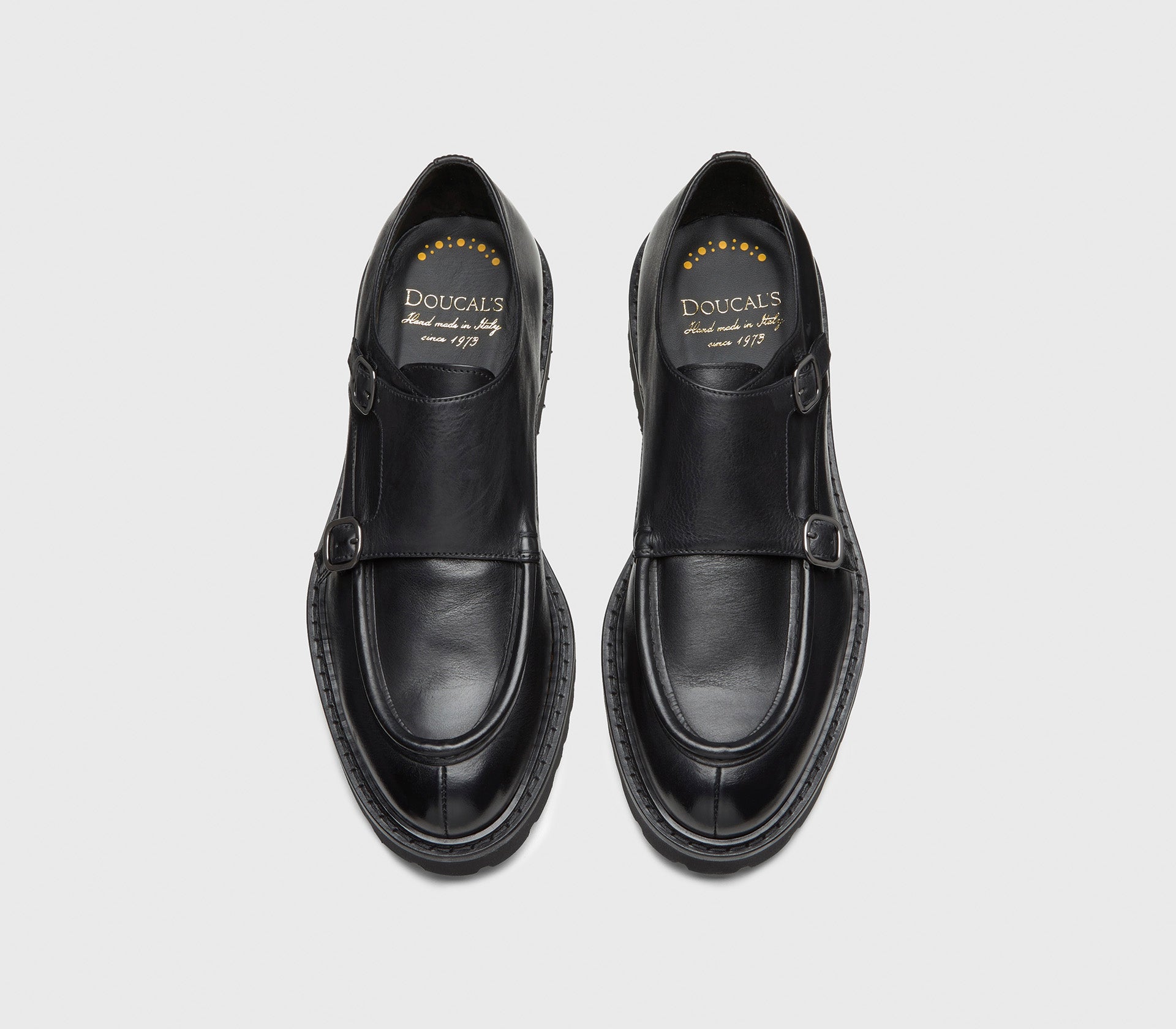 Black leather double-buckle shoe.