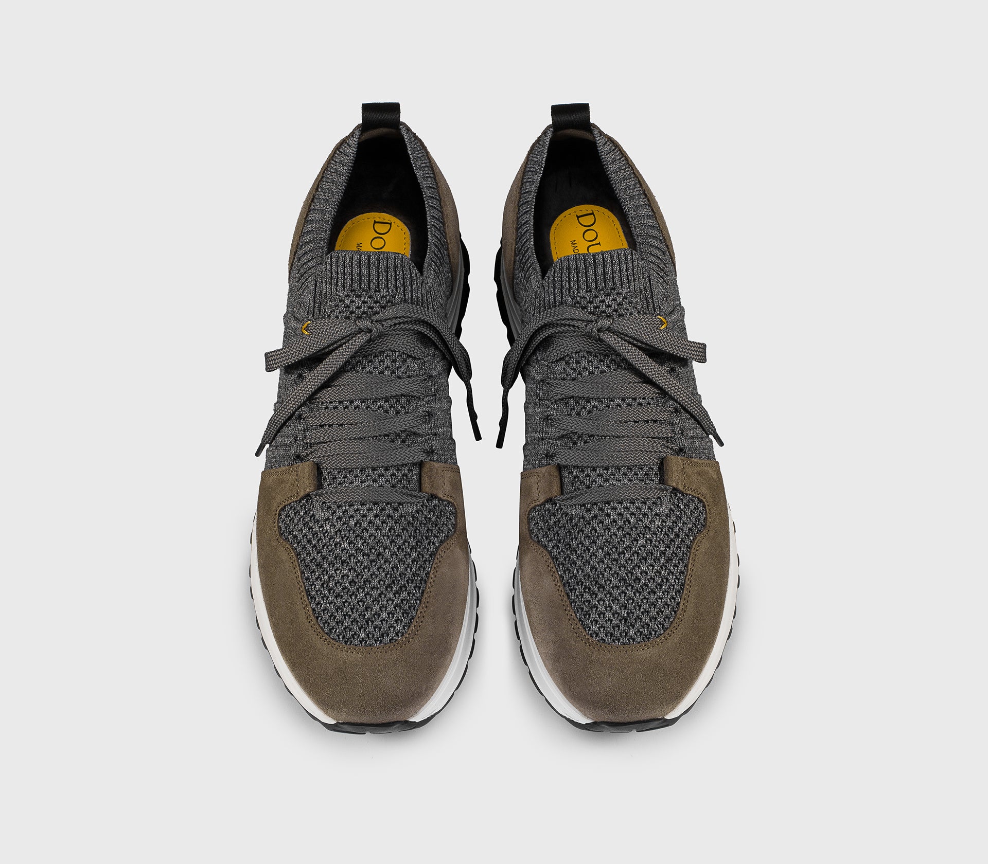 Charcoal grey bi-material sneaker with brown details.