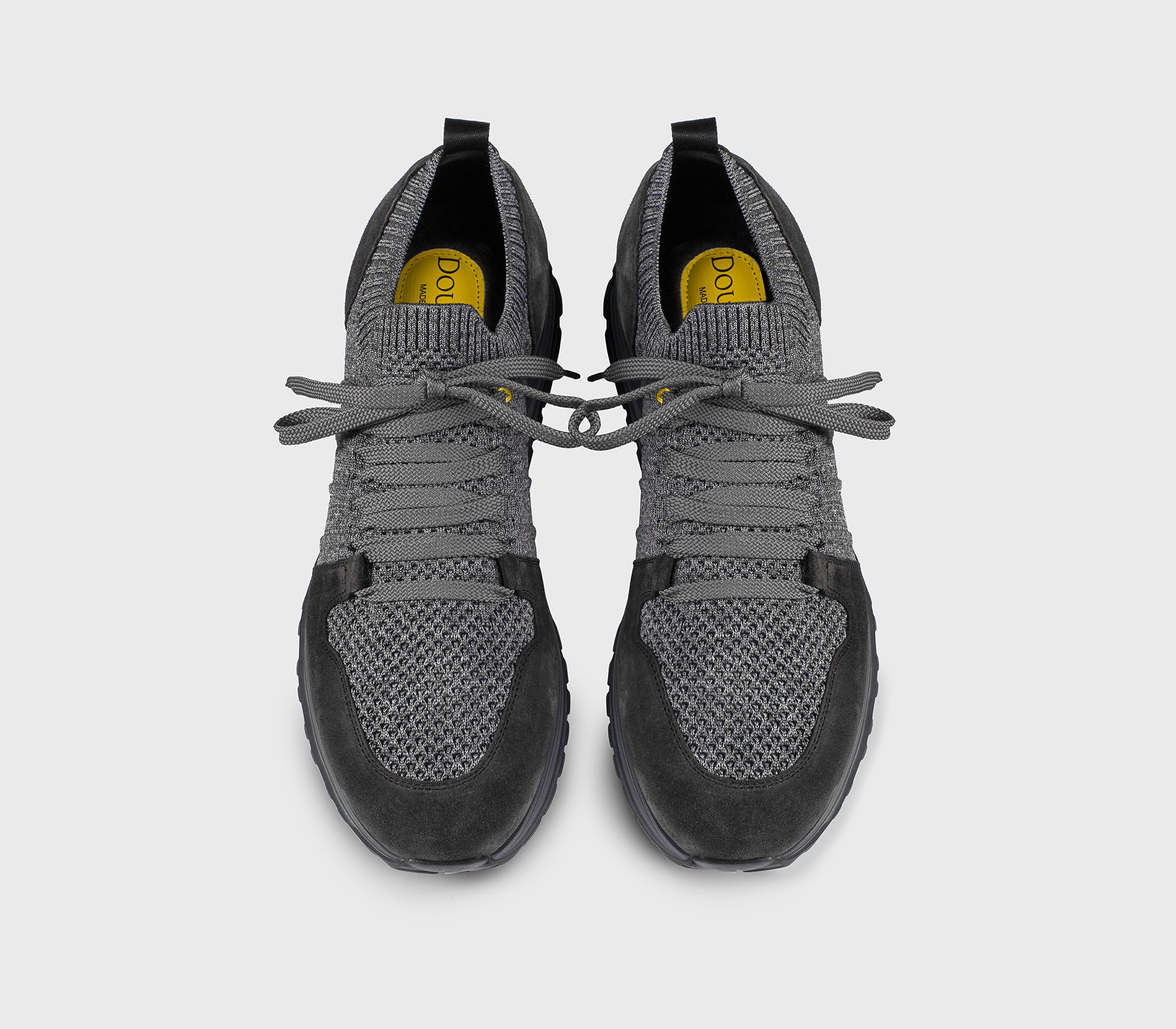 Grey bi-material sneaker with charcoal grey details.