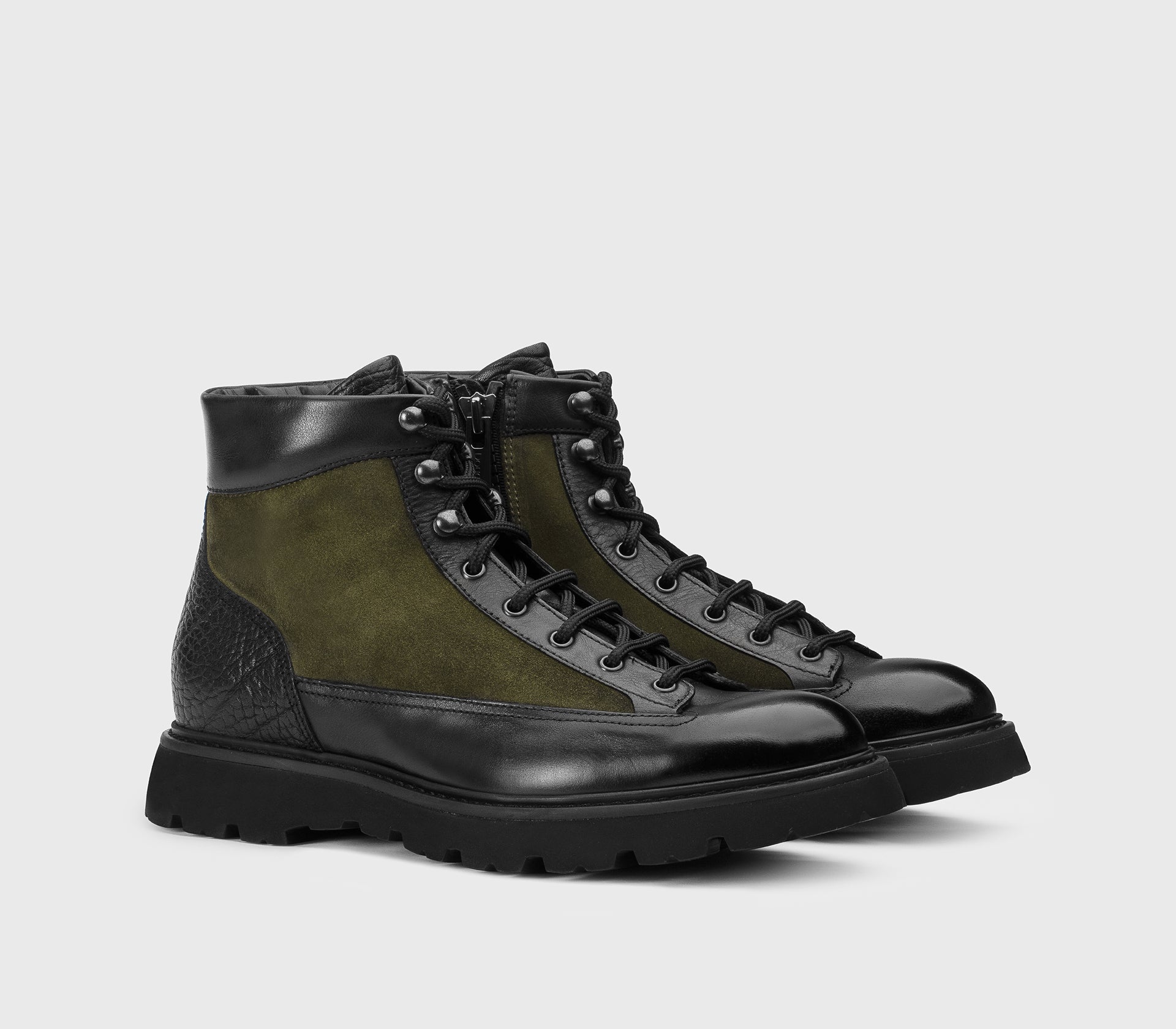 Lace-up ankle boot made from a combination of materials in black and green