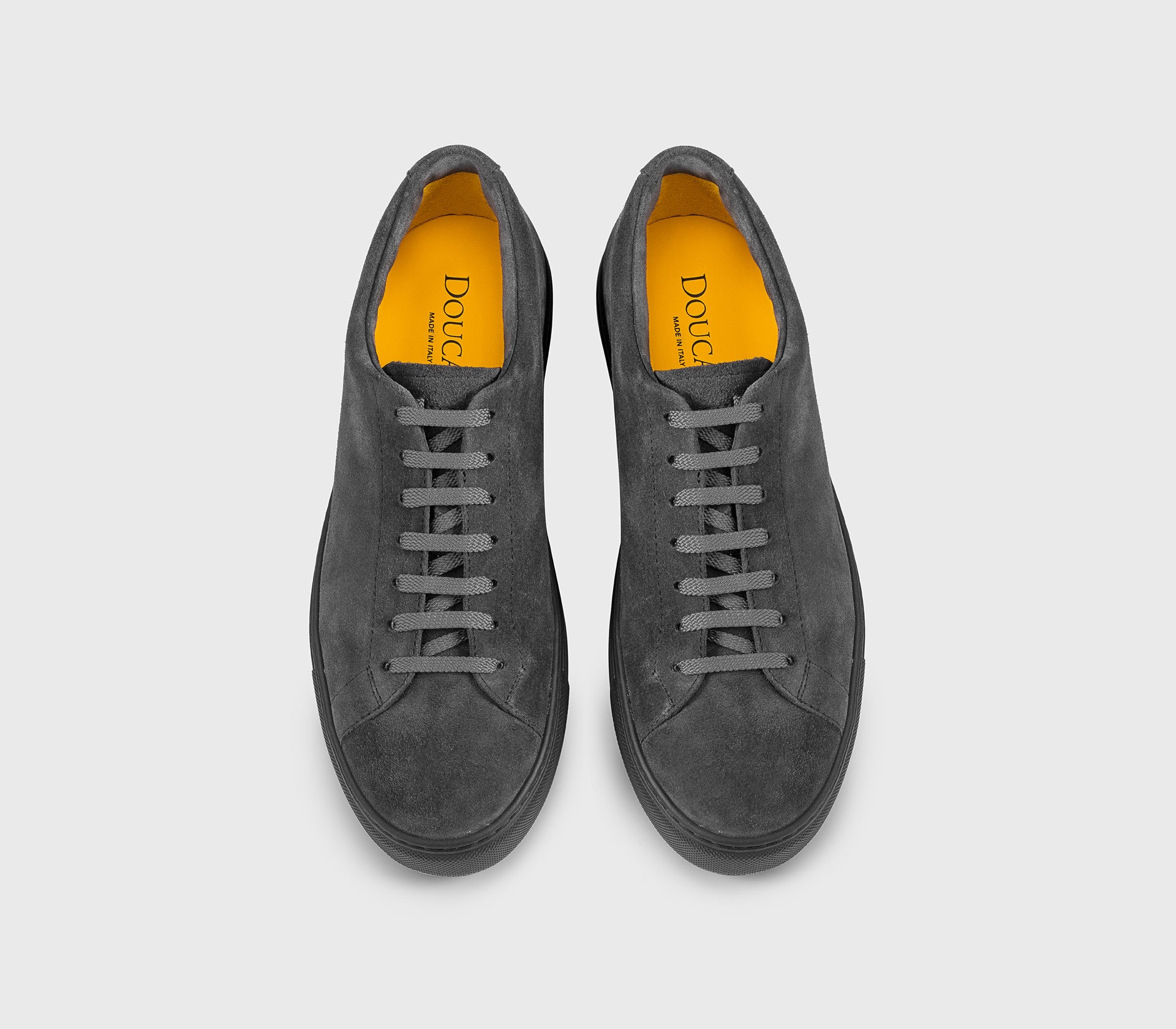 Charcoal grey suede sneaker.